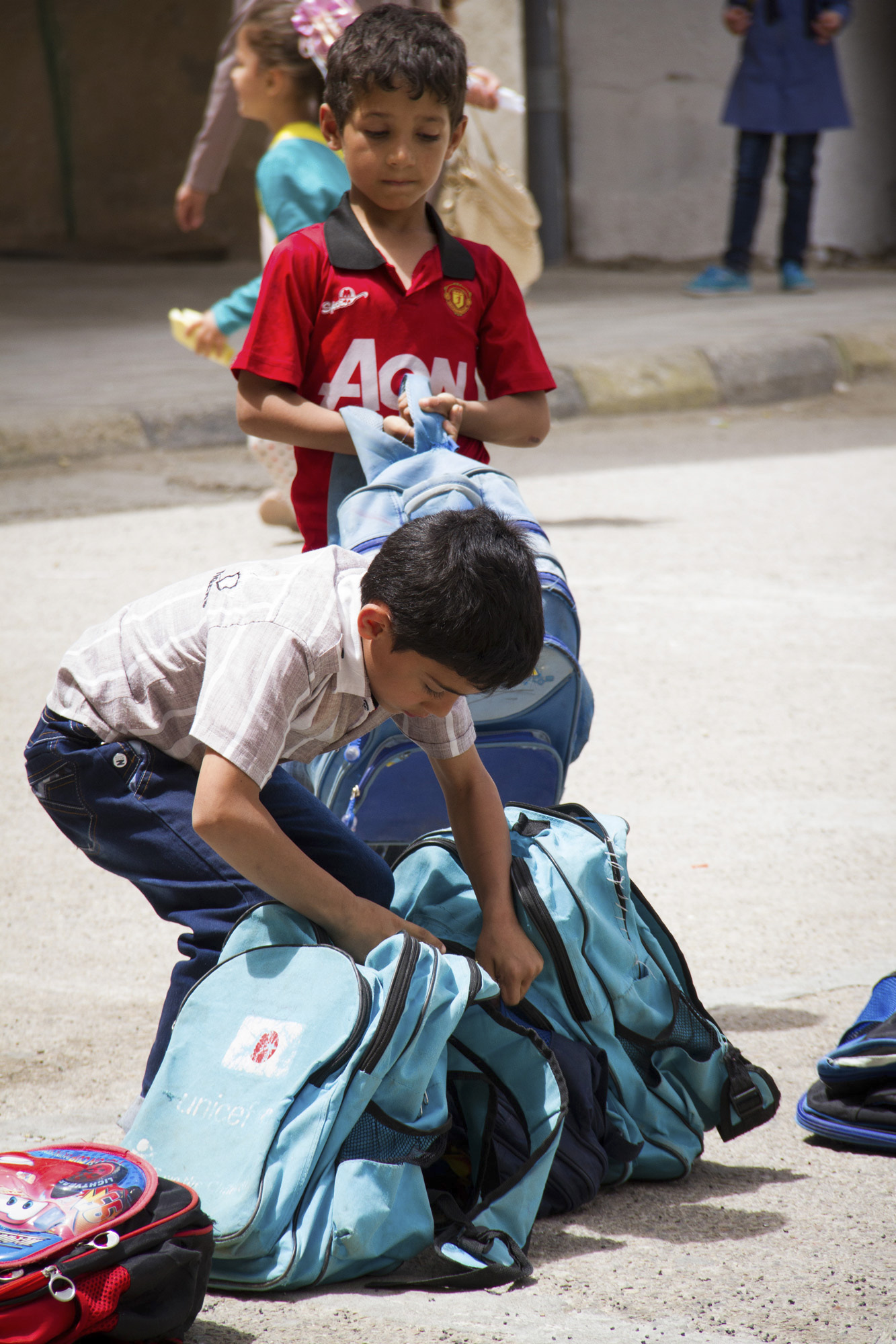 Most of the Syrian refugee students have a UNICEF school bag. They depend on the help of international organizations to participate in school life.