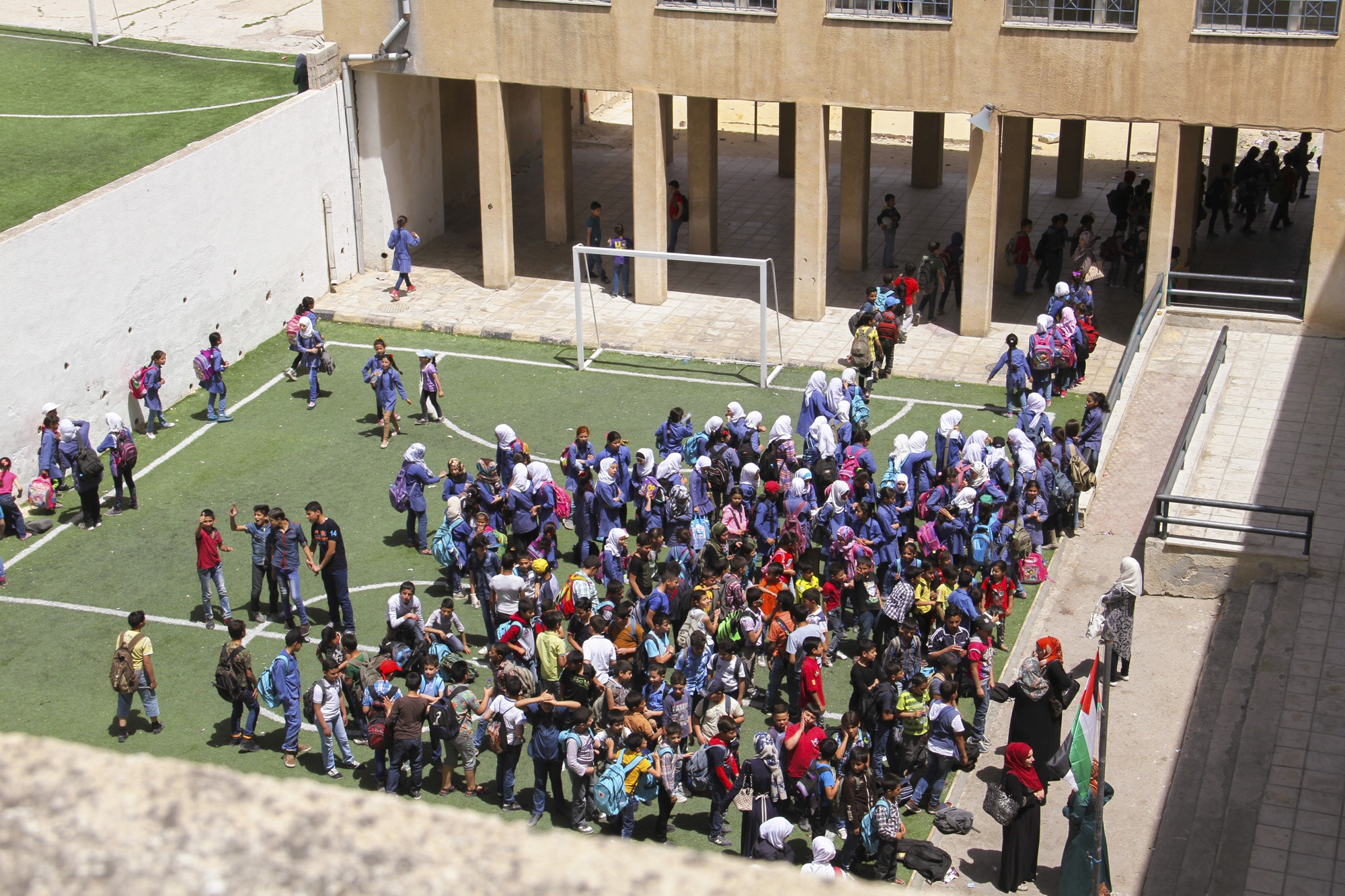 After the welcoming ritual, the students enter the school lined up by class, one after another in a disciplined manner.