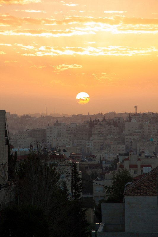 The sunsets and sunrises in Amman are breathtaking. The white buildings are glided by the red sun and the birds are chirping.