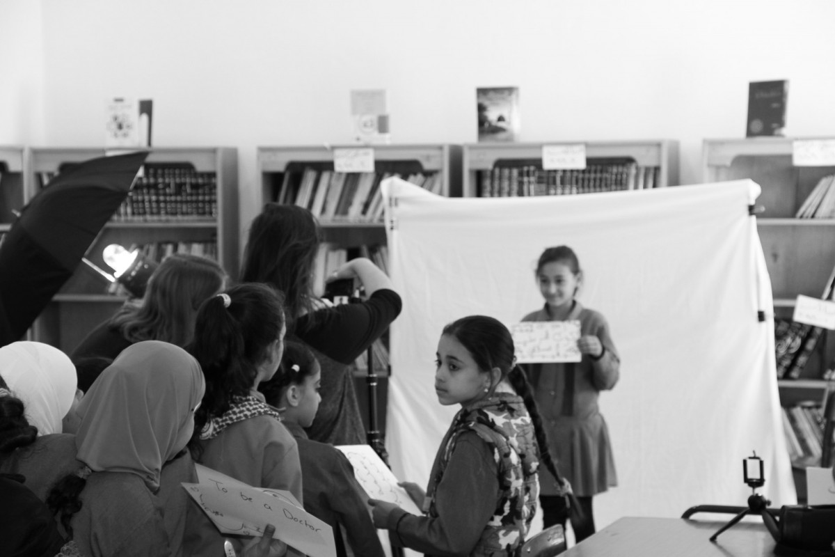 Students waiting in line closely observe the shooting and help us wherever they can.